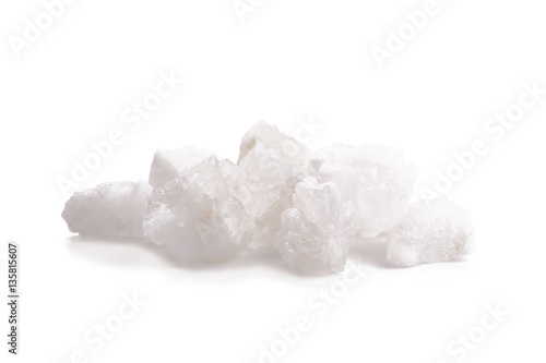 Organic sea white salt tablets on white background.