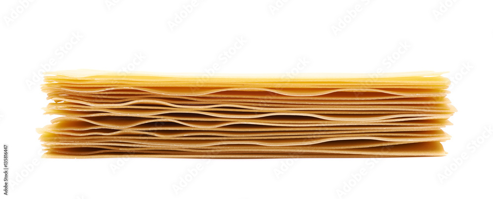 Pile of dried lasagna sheets isolated Pile of dried lasagna sheets isolated