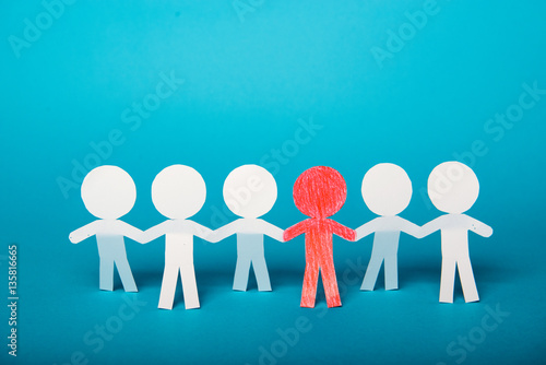 A group of red and white paper people