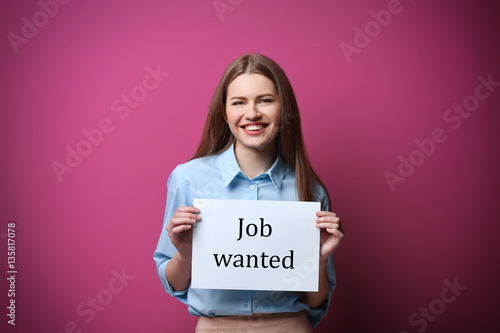 Woman holding paper with te...