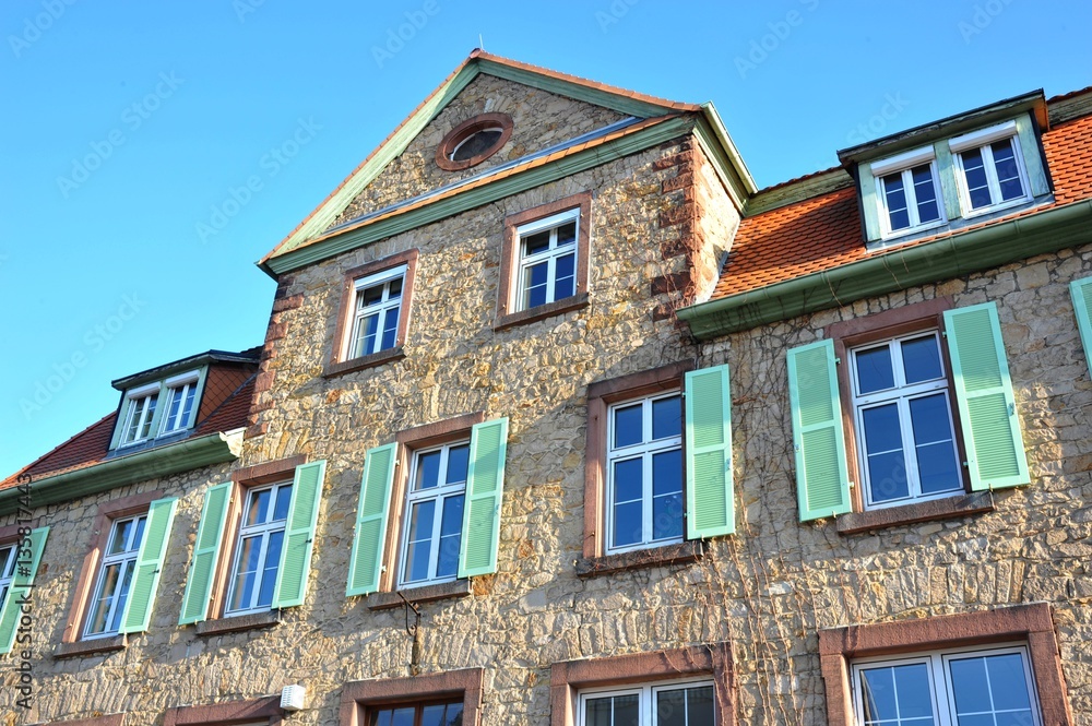 Renovated House-Front with Dormer Windows (Gauben) at tiled Roof (Ziegeldach)