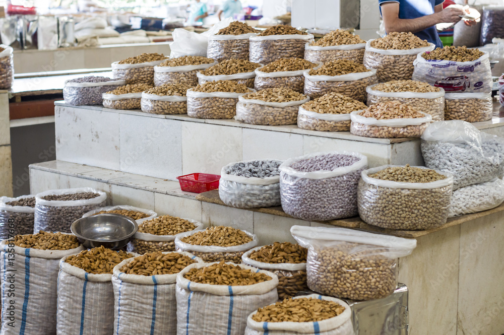 The stall with dried fruits at the Siab Dekhkhan Bazaar offers different raisins, apricots, prums and figs in Samarkand, Uzbekistan The stall with dried fruits at the Siab Dekhkhan Bazaar offers different raisins, apricots, prums and figs in Samarkand, Uzbekistan