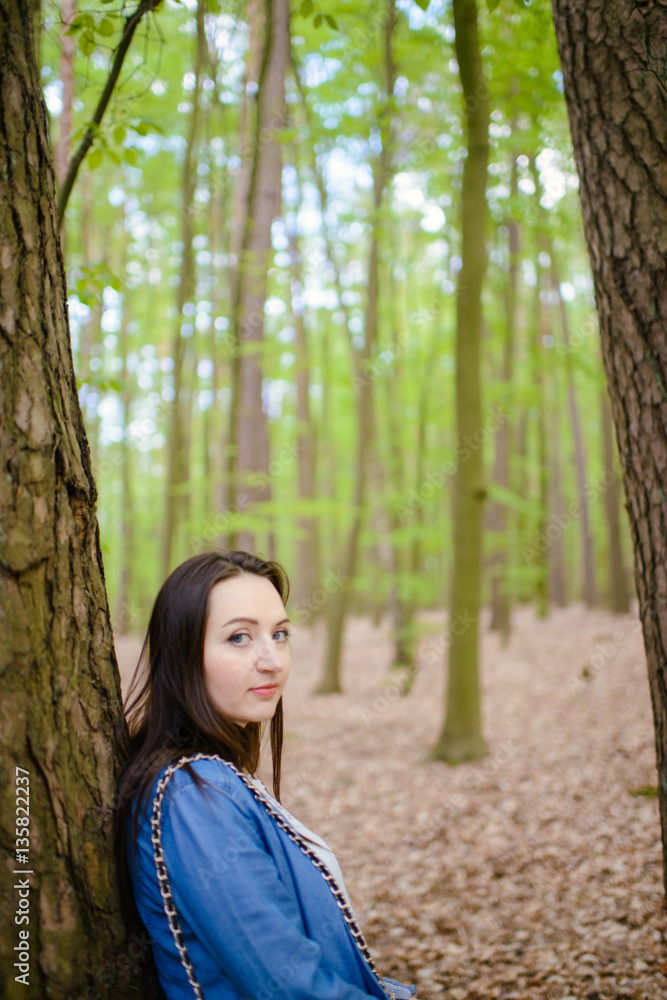 Young girl on a walk in the forest Young girl on a walk in the forest