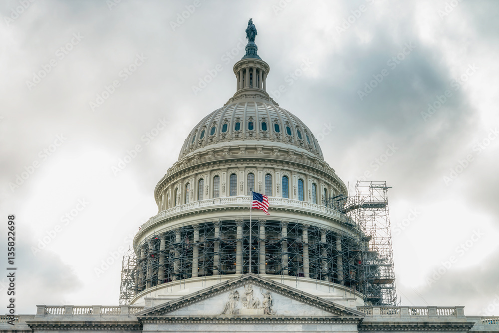 Obraz premium WASHINGTON DC, USA The United States Capitol view from the street. In 2014, scaffolding was erected around the dome for a restoration project scheduled to be completed by 2017. 
