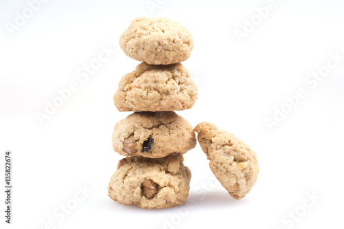 Homemade cookies with nuts and raisins on a white background