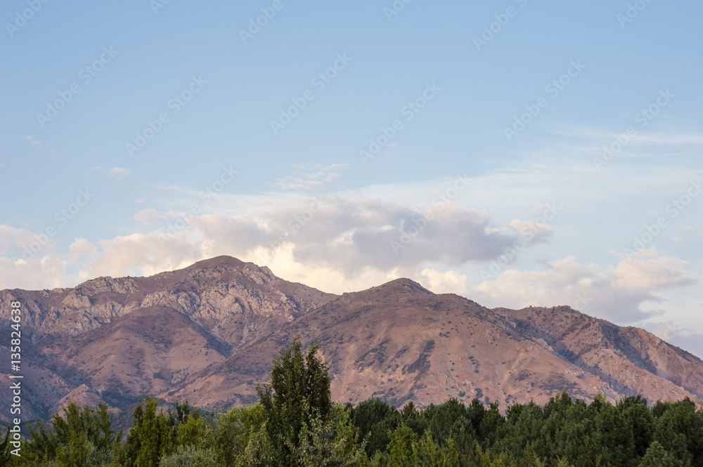 Western Tian Shan mountains in Ugam-Chatkal National Park view from Charvak Reservoir, Uzbekistan Western Tian Shan mountains in Ugam-Chatkal National Park view from Charvak Reservoir, Uzbekistan
