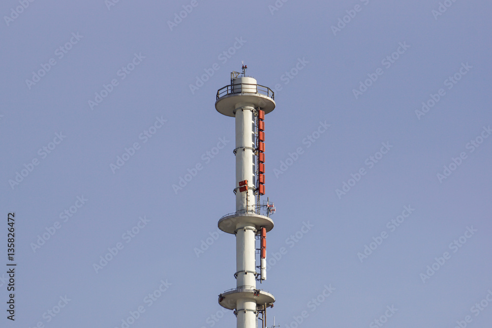 Cellphone telecomunication tower with blue sky