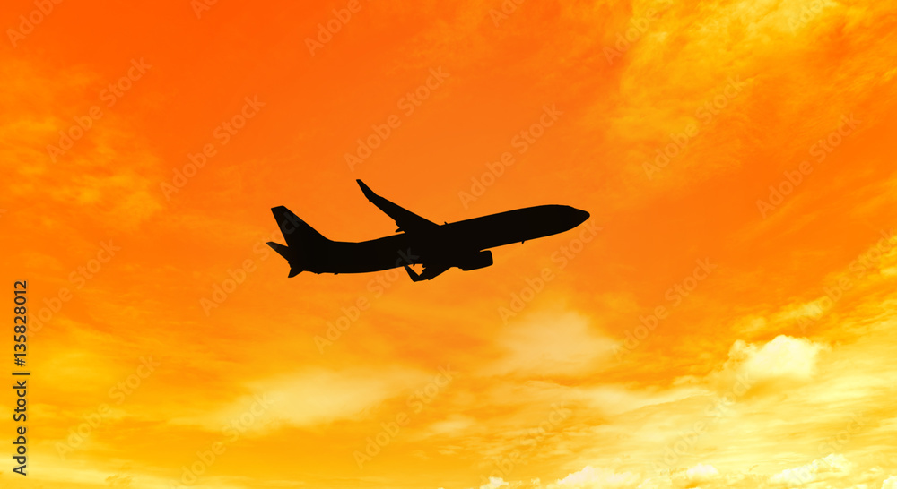 Silhouette of an airplane taking off on sunset background Silhouette of an airplane taking off on sunset background