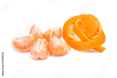 mandarin slice and peel on white
