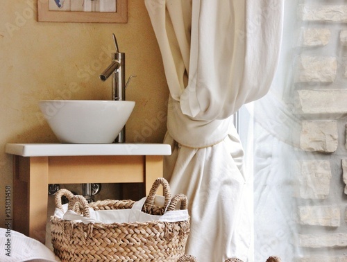 Interior detail of sink near a curtain photo