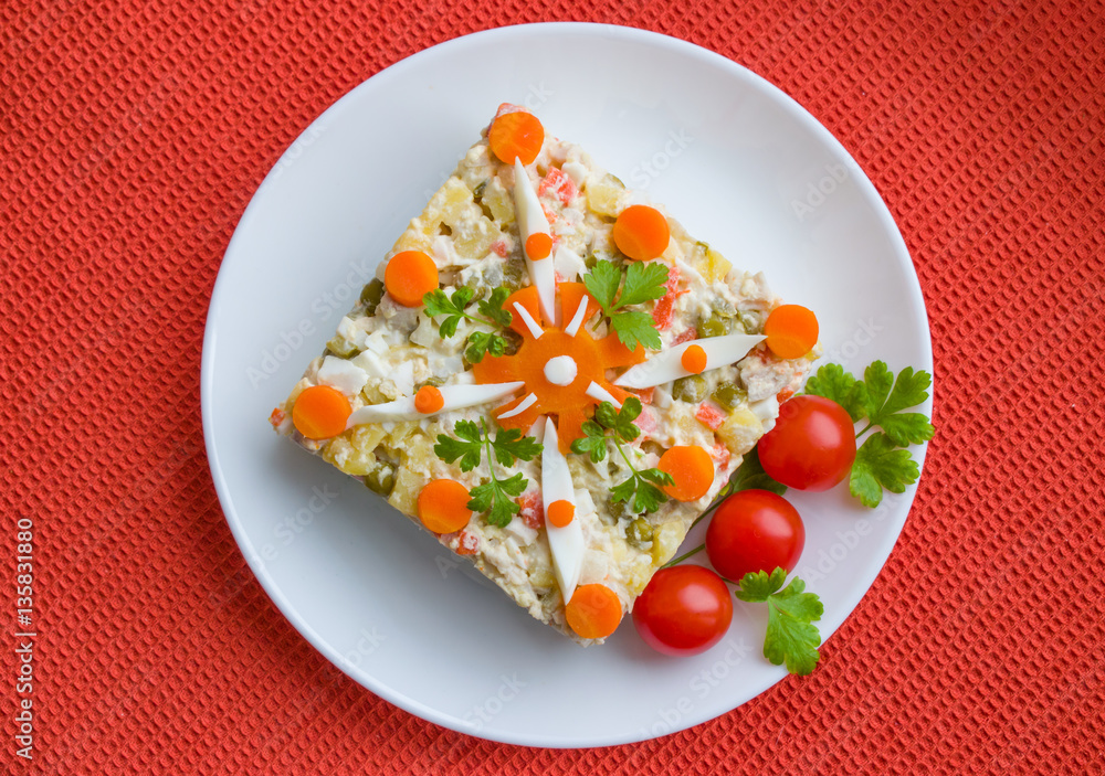 Salad of boiled chicken with boiled carrots, potatoes, egg and cucumber top view Salad of boiled chicken with boiled carrots, potatoes, egg and cucumber top view