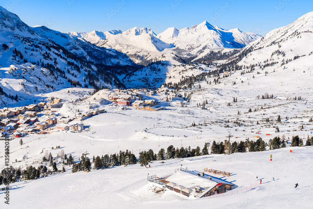 View of mountain hut and Obertauern village in winter season, Austria