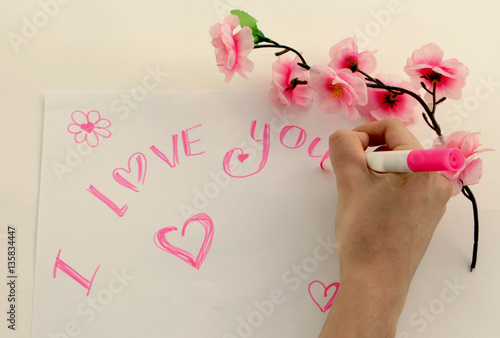 Foto girl writes a love confession