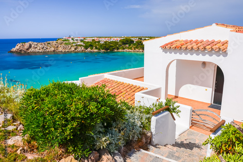 Obraz na płótnie Typical holiday villa in beautiful bay of Arenal d'en Castell, Menorca island, Spain w salonie
