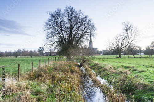 Salisbury cathedral and the West Harnham water meadows, UK. photo