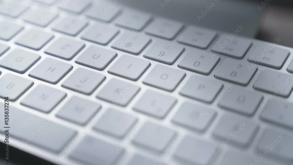 very close Close-up computer keyboard in office - business people, smooth tracking shot very close Close-up computer keyboard in office - business people, smooth tracking shot