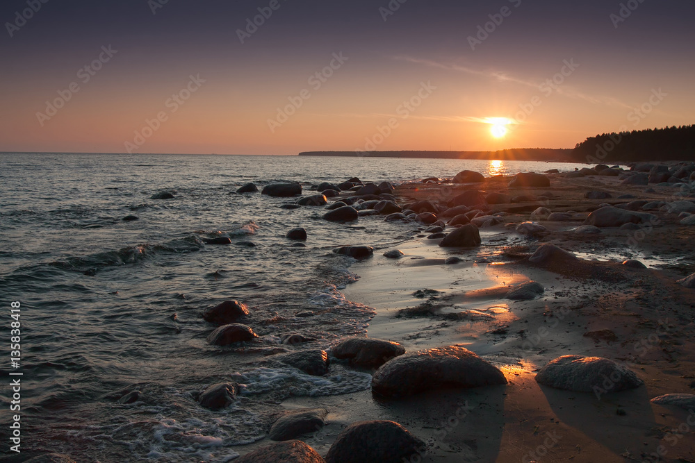 Sunset on the rocky beach