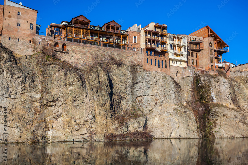 Houses on the edge of a cliff above the river Kura. Tbilisi, the