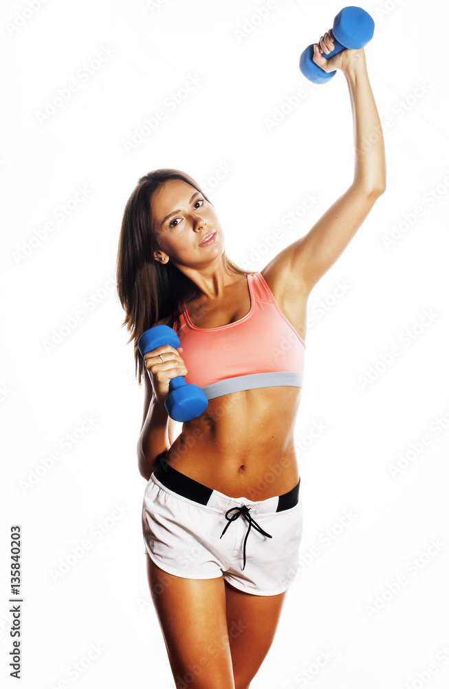 young pretty slim woman with dumbbell isolated young pretty slim woman with dumbbell isolated
