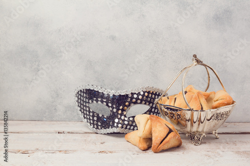 Vintage vase with hamantaschen cookies or hamans ears for Jewish carnival holiday Purim photo