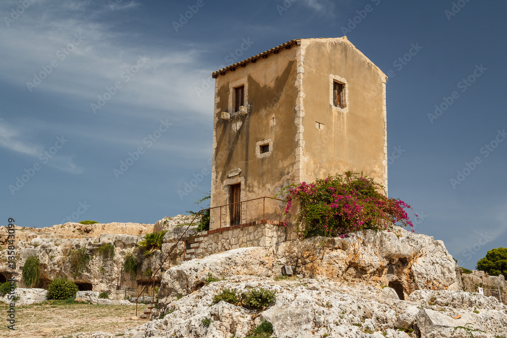 Small house built on top the ancient Greek theatre in Syracuse,