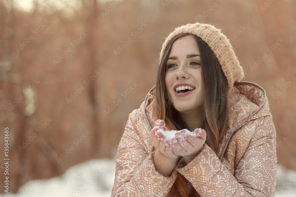 Portrait of beautiful girl with snow on her hands Portrait of beautiful girl with snow on her hands
