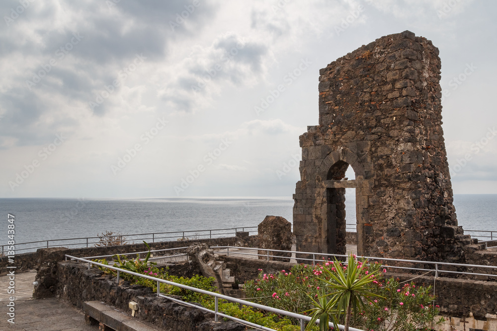 Ruins of the Norman castle in Aci Castello, Sicily island, Italy