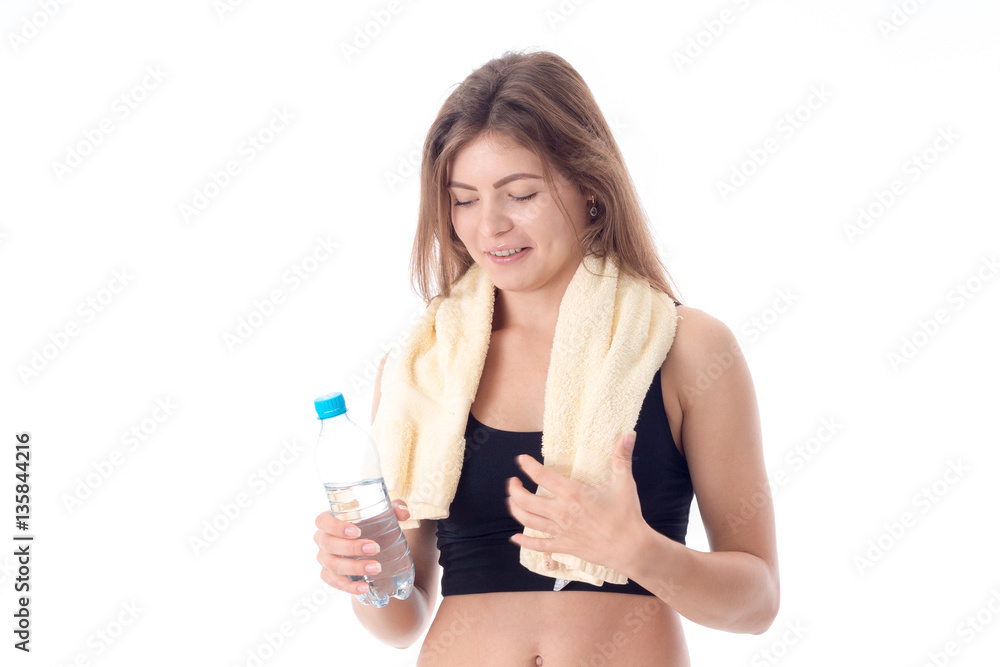 young girl with towel holding bottle of water in her hand young girl with towel holding bottle of water in her hand