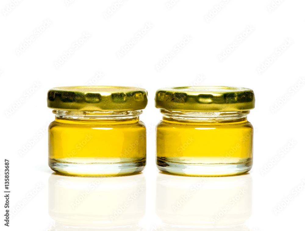 Transparent jar of liquid honey Transparent jar of liquid honey