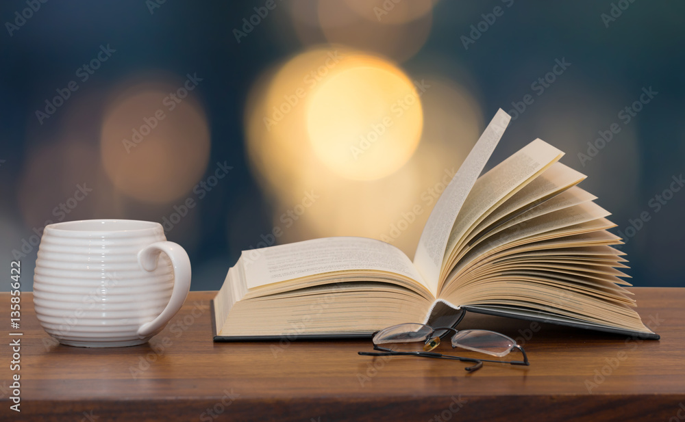 Fototapeta premium book with cup and glasses