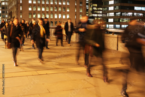 Commuters on London Bridge at night