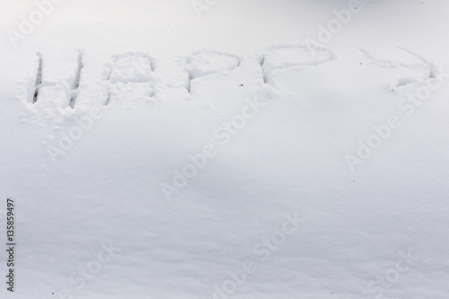 the inscription on the snow - happy