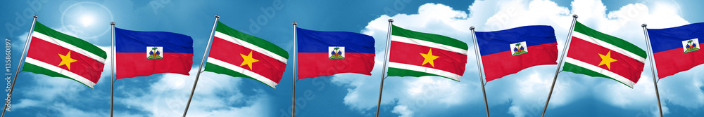 Suriname flag with Haiti flag, 3D rendering Suriname flag with Haiti flag, 3D rendering