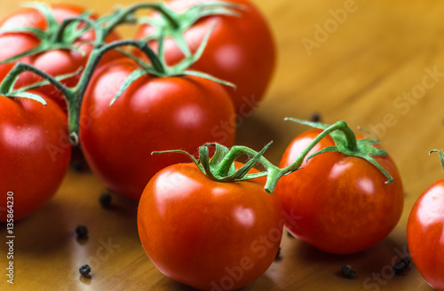 Fresh grape tomatoes with spices for use as cooking ingredients. Healthy eating.