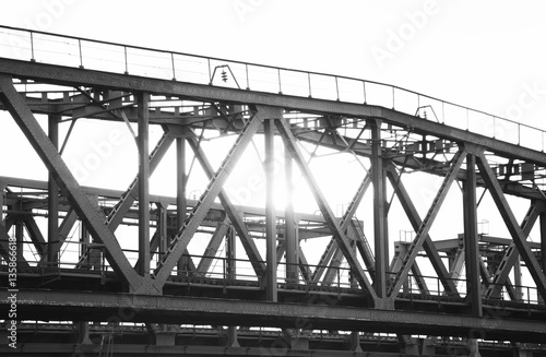 Old steel railway bridge on the river. Empty train-bridge in sunset  © RomanWhale studio