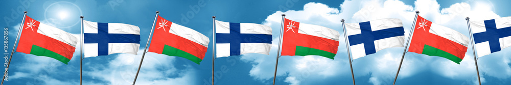 Oman flag with Finland flag, 3D rendering Oman flag with Finland flag, 3D rendering
