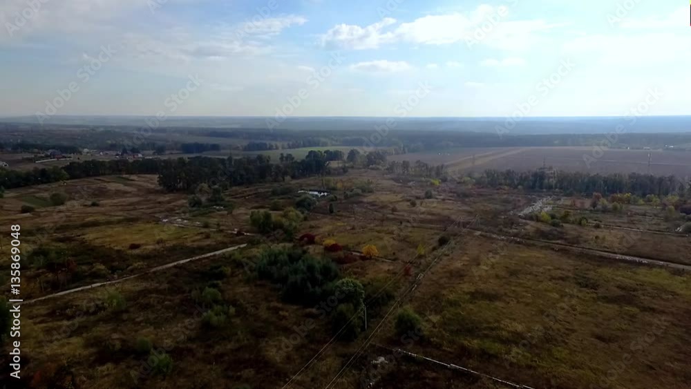 Aerial countryside village nature landscape HD video. Horizon: farm fields and blue sunny sky with clouds Aerial countryside village nature landscape HD video. Horizon: farm fields and blue sunny sky with clouds