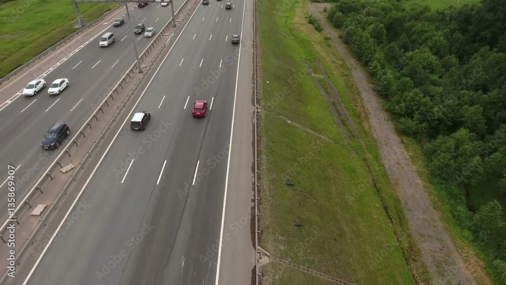 Aerial view at the ring highway. Camera flying across road. St. Petersburg, Russia
Aerial view at the ring highway. Camera flying across road. St. Petersburg, Russia