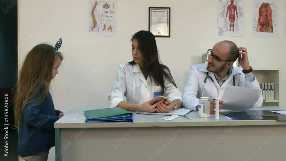 Cute little girl visiting her mother at work in hospital Cute little girl visiting her mother at work in hospital