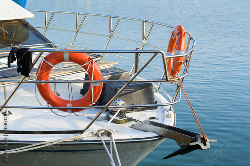 Lifebuoy on board white boat.