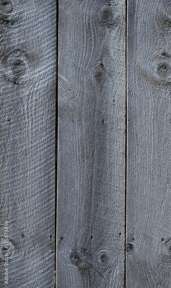 Naklejka premium Aged wooden board siding on a building