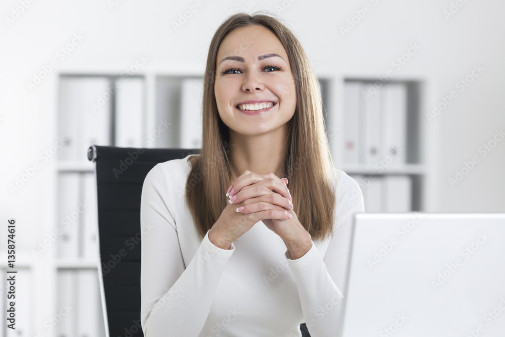 Portrait of smiling blond businesswoman in office Portrait of smiling blond businesswoman in office