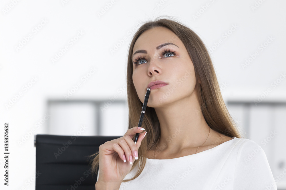 Thinking girl in white at work Thinking girl in white at work