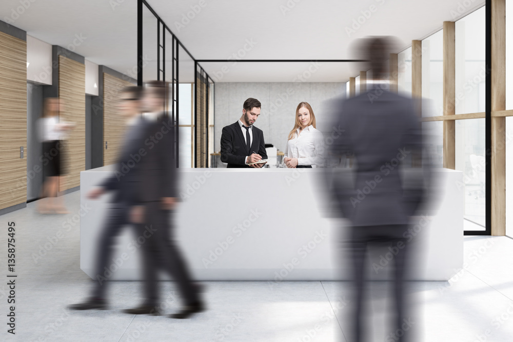 Walking people in office with white reception Walking people in office with white reception