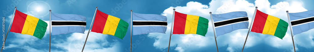 Guinea flag with Botswana flag, 3D rendering Guinea flag with Botswana flag, 3D rendering