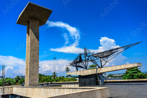 Concrete portal sculpture and metal sculpture of the National Monument to the Dead of the Second World War with beautiful blue sky and white clouds on the background, Rio de Janeiro, Brazil photo