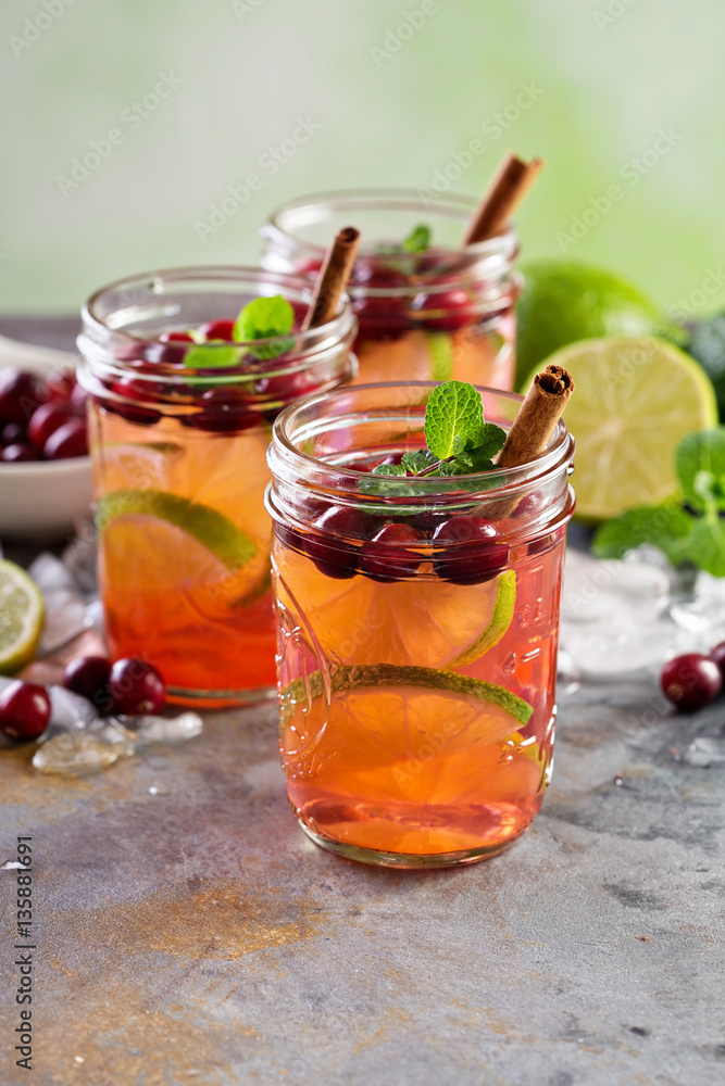Refreshing winter drink with lime and cranberry Refreshing winter drink with lime and cranberry