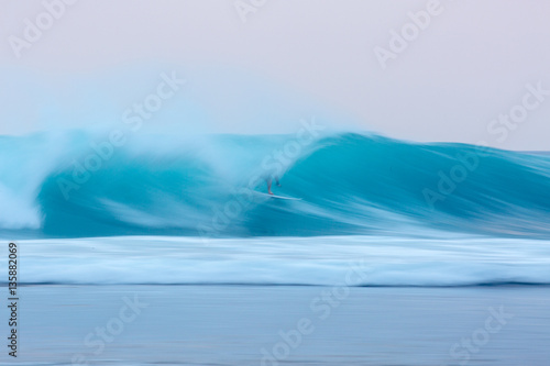 Surfer barreled at sunset 