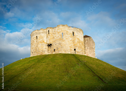 Small castle on a hill in a small town