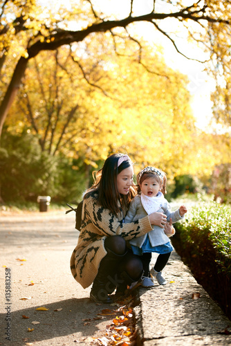 Asian mother and daughter fun in the autumn